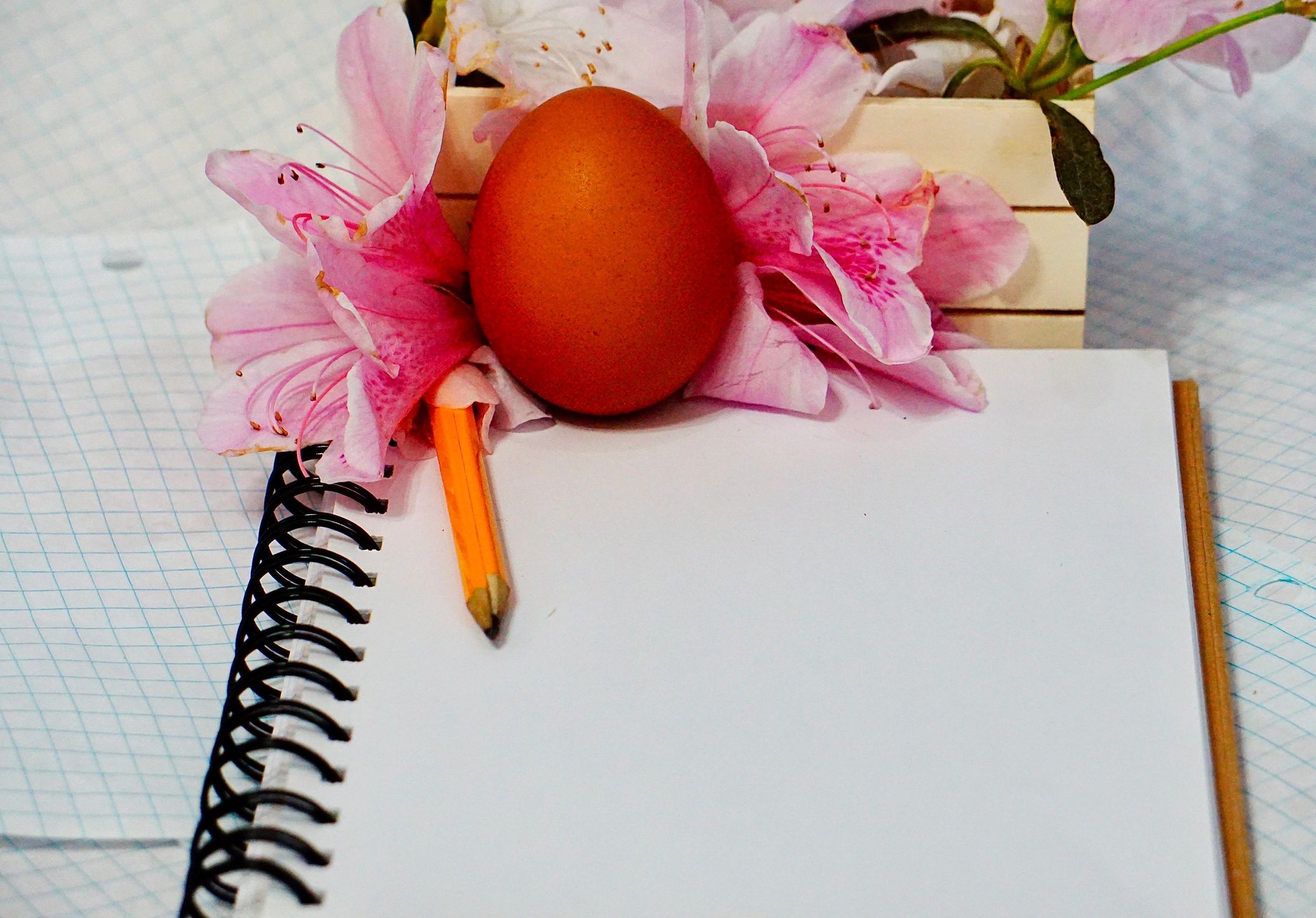 Notebook and pencil on a writer's desk